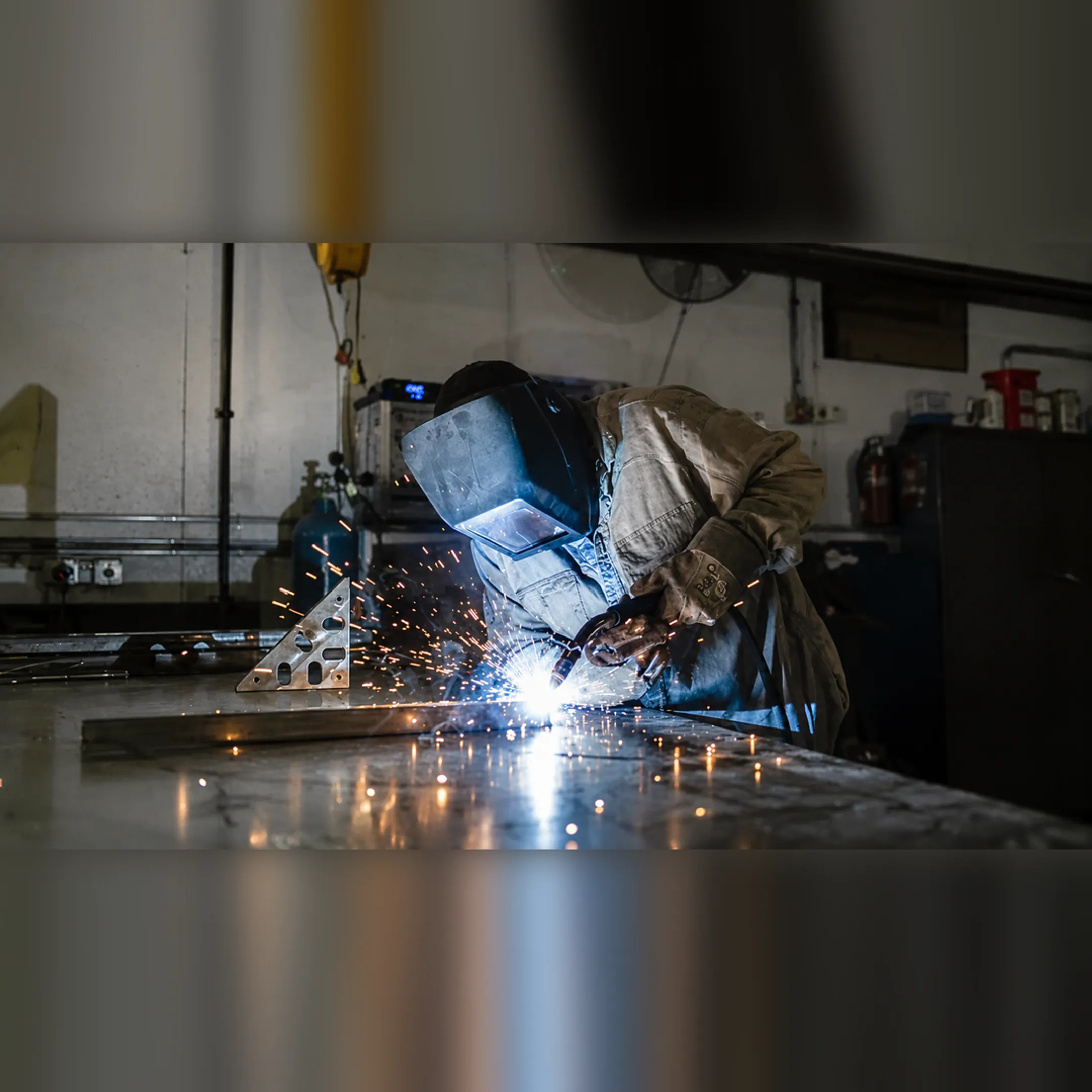 Mobile welder preparing an on-site fabrication project