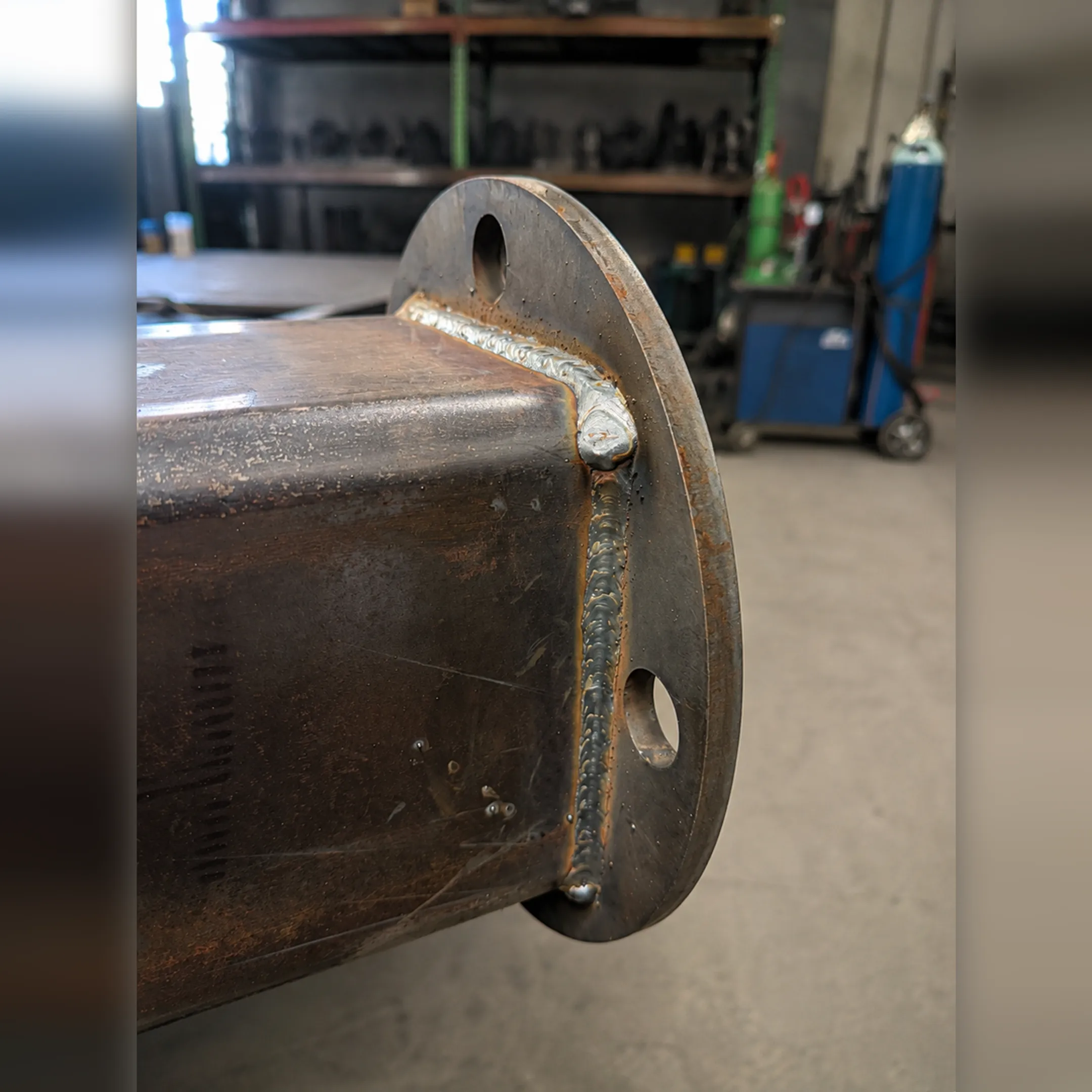 Welder following fabrication plans