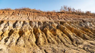 Bare Southern California hillside showing active erosion and exposed soil