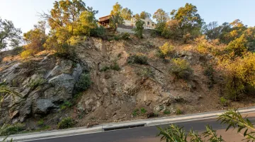 Southern California hillside home on sloped unstable terrain showing foundation risk