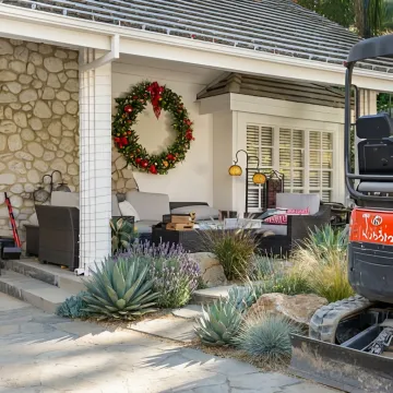 Modern hillside hardscape with patio and retaining walls