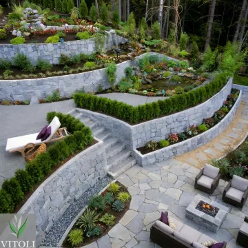 Engineered retaining wall supporting a hillside outdoor space