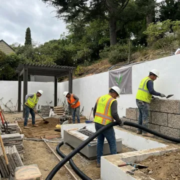 Terrace construction crew building hillside outdoor living space