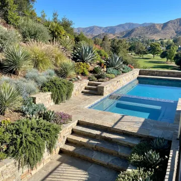 Stone pool area hardscape with terraced walls