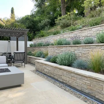 Engineered retaining wall in a landscaped Huntington Beach backyard