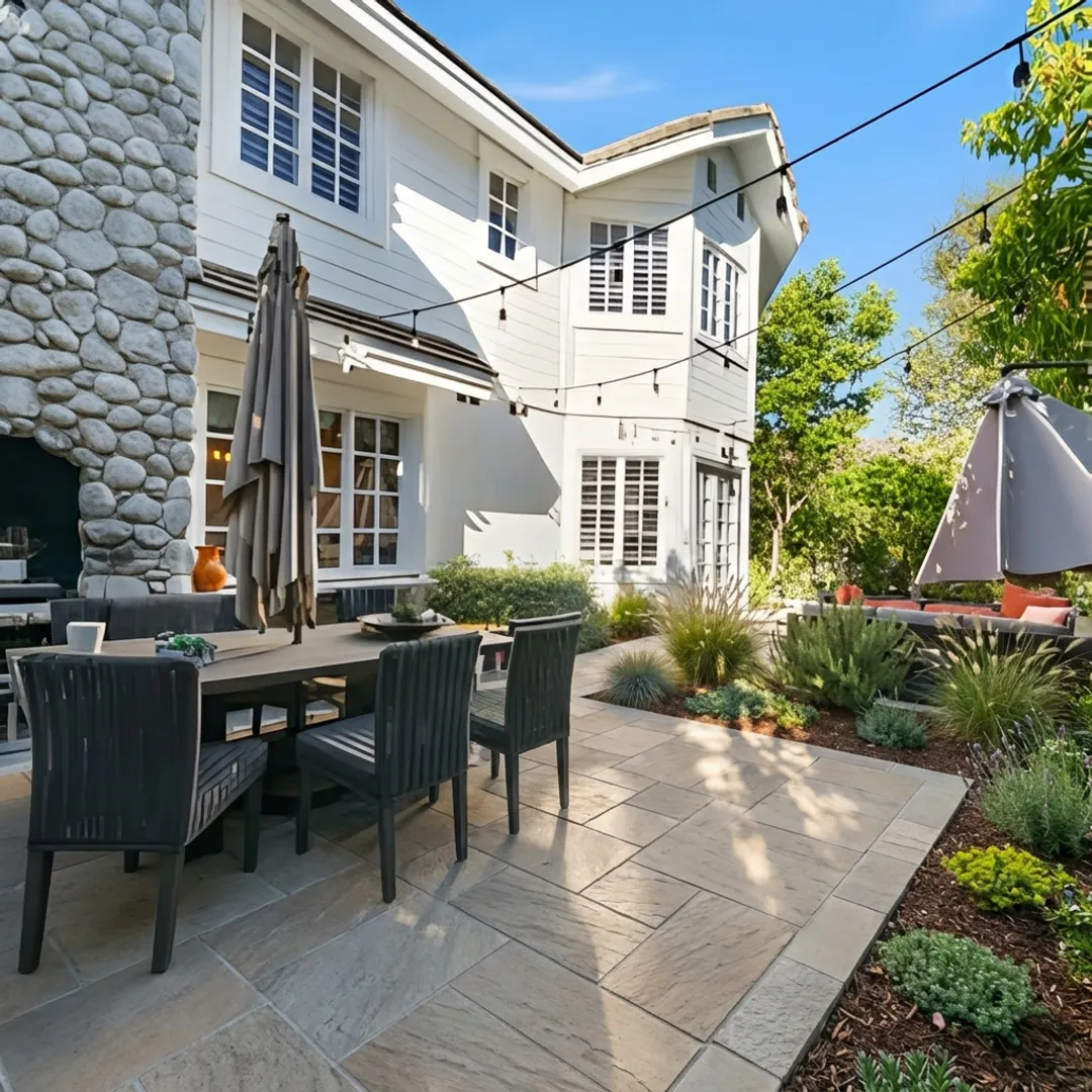 New paver walkway through landscaped yard