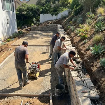 Hardscape crew preparing a luxury patio base