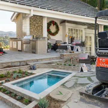 Luxury hillside outdoor living space with custom kitchen and patio