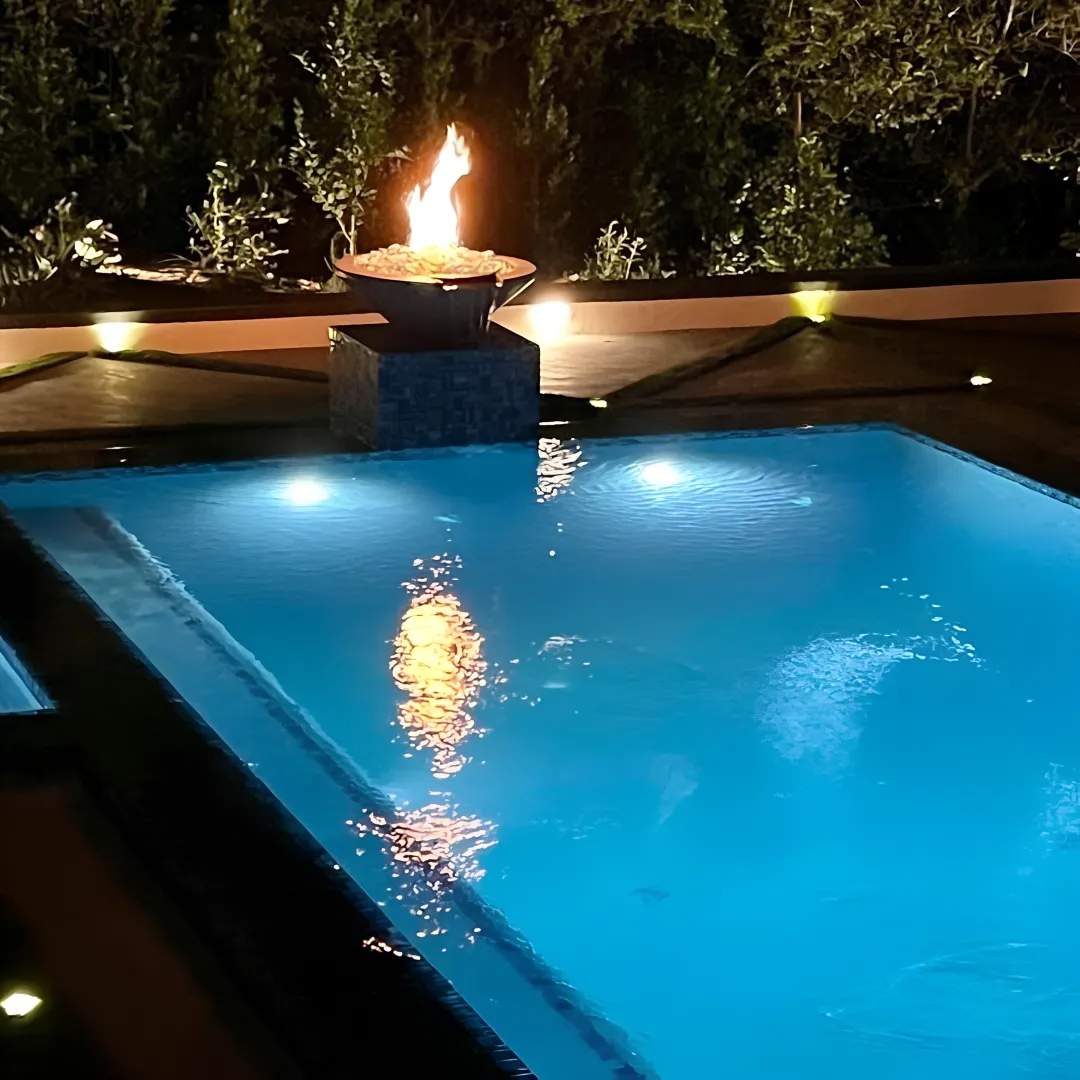Luxury outdoor pool terrace with hillside views