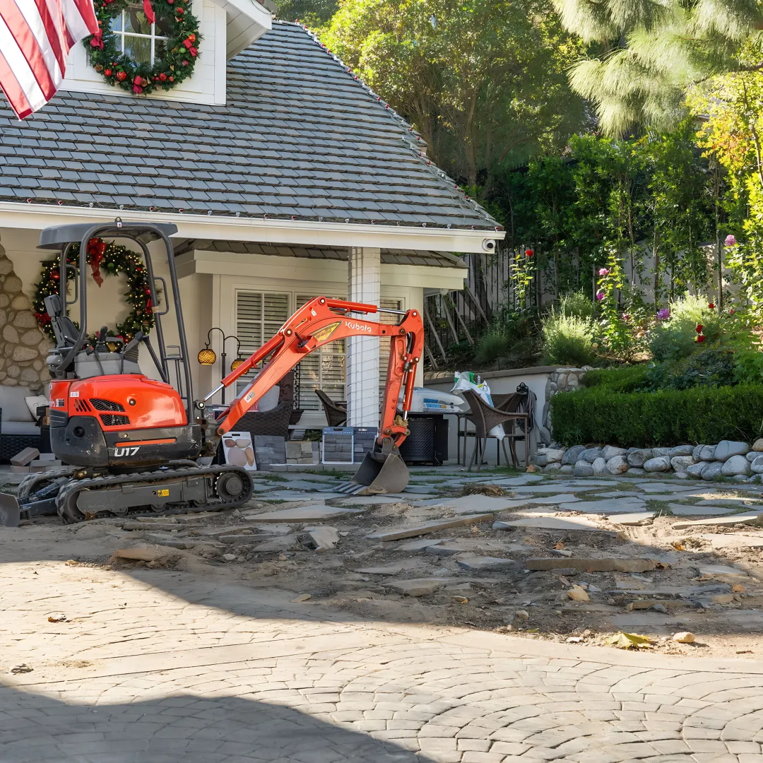 Hardscape crew installing a backyard patio