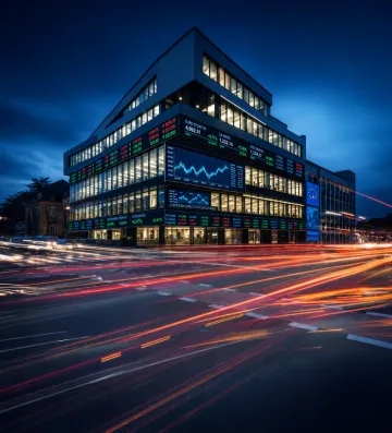Luxembourg Stock Exchange trading floor with digital market data displays