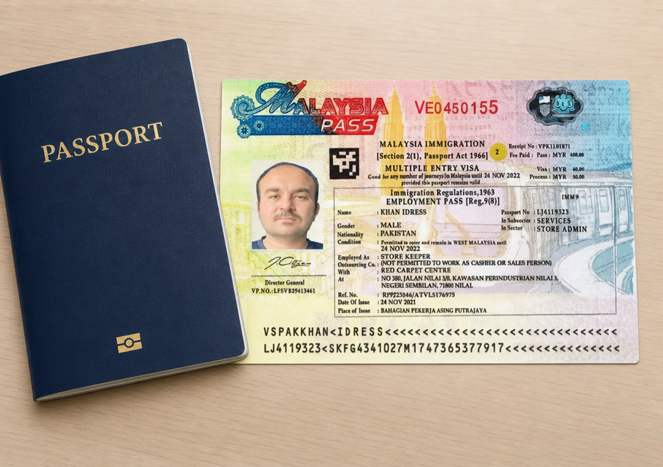 Malaysian Employment Pass visa document and passport for foreign business owners