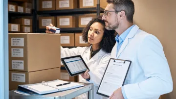 Hospital procurement staff reviewing group purchasing organization supply contracts