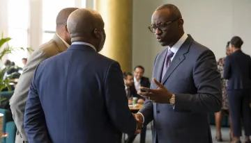 Business professionals networking at a Moroccan trade event or meeting