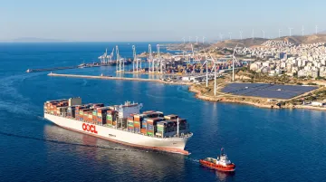Greek shipping port and renewable energy infrastructure representing key investment sectors