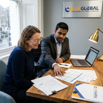 Small business owner reviewing tax reports with an advisor