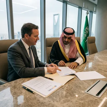 Business professionals reviewing Saudi company formation documents
