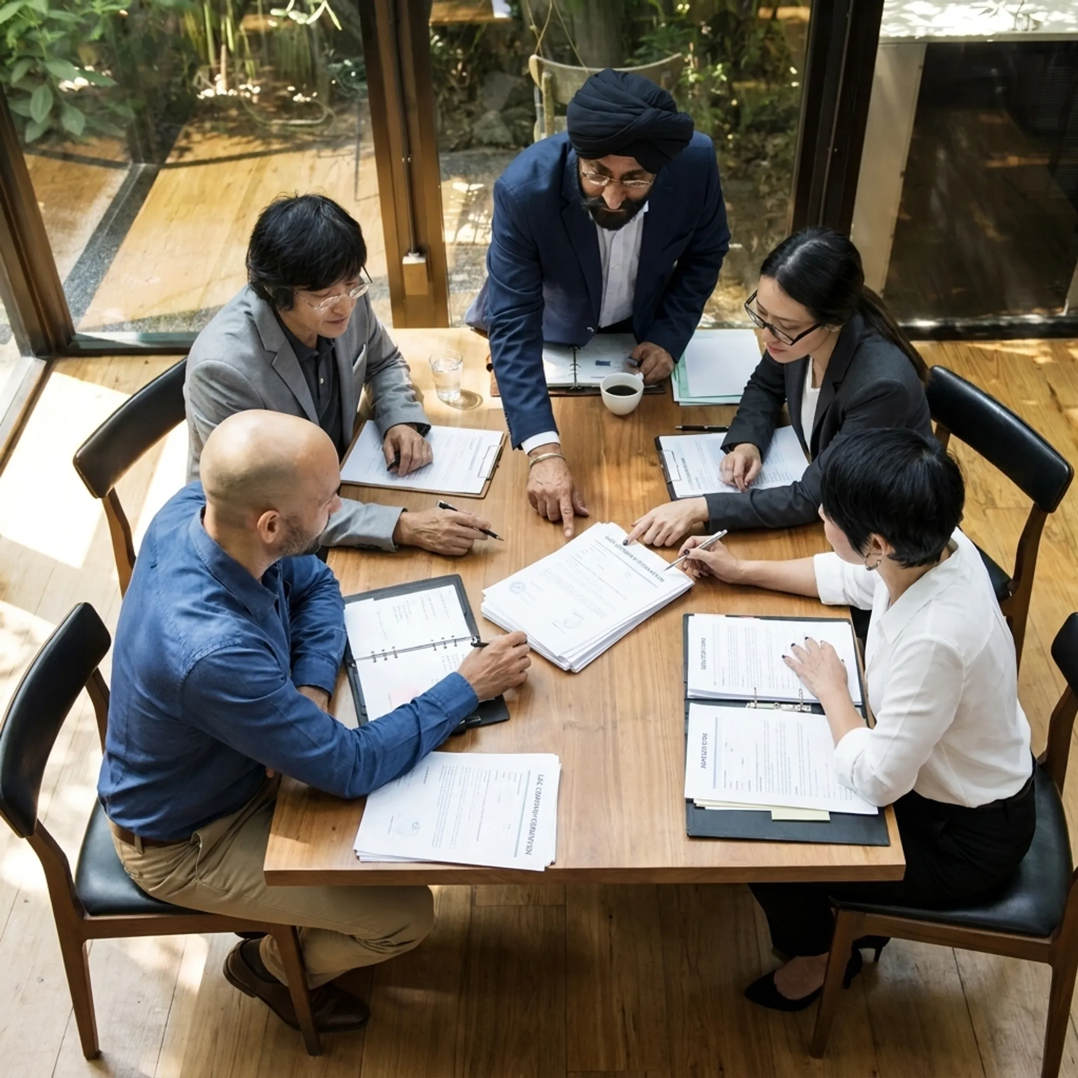 Business advisors discussing RAK ICC company formation documents with US business owners