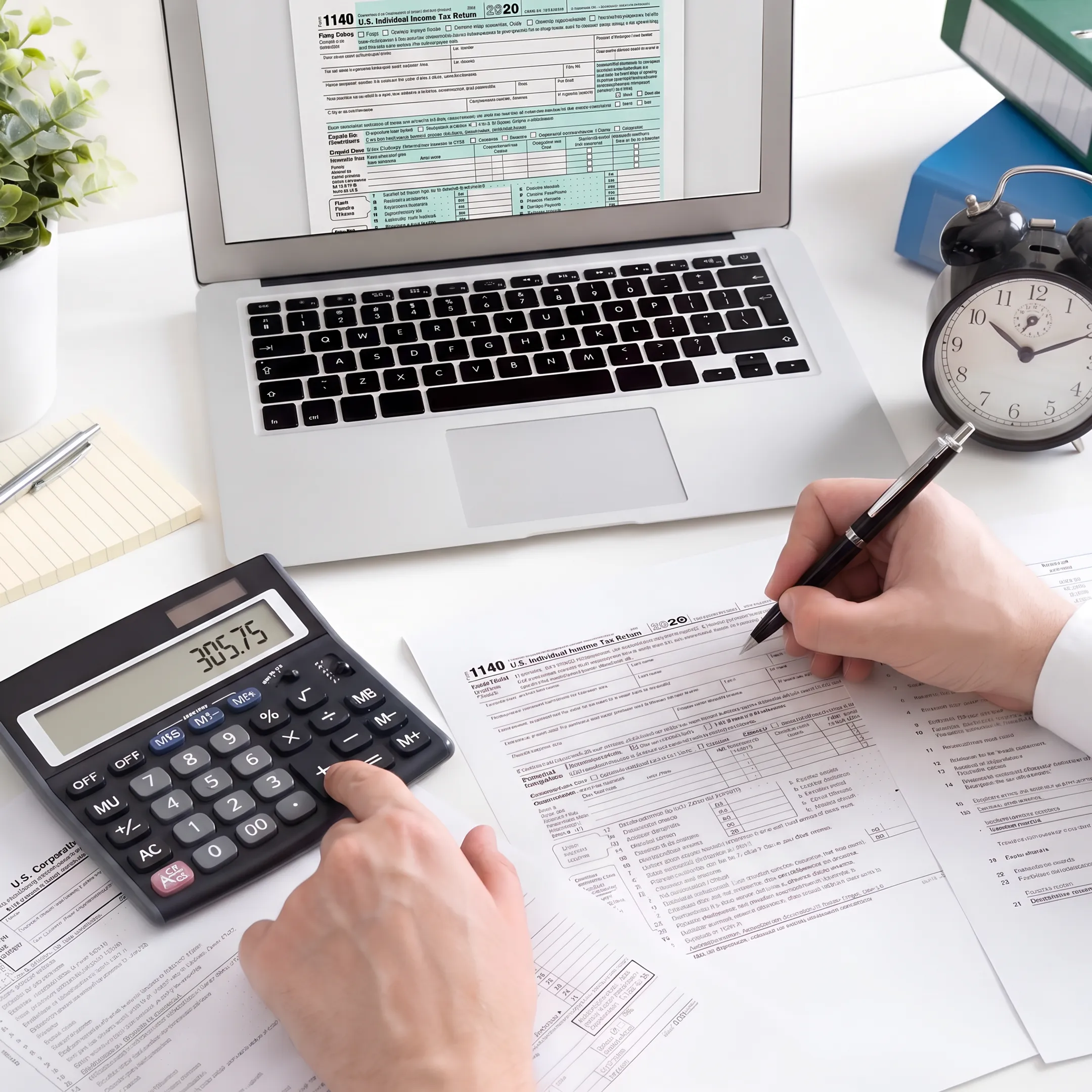 Accountants reviewing corporate tax documents with business financial records