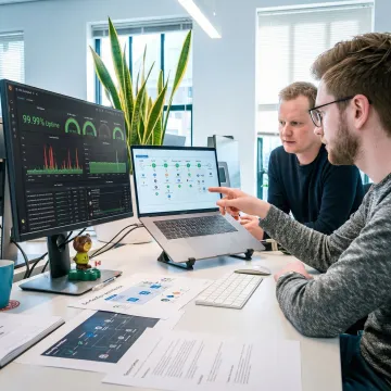 DevSecOps team collaborating on pipeline automation and SRE implementation workflow