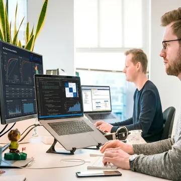 AI and machine learning consultants reviewing enterprise data dashboards