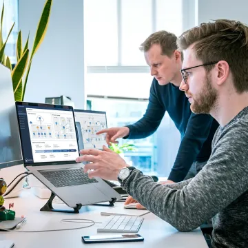 IT consultants reviewing business technology systems