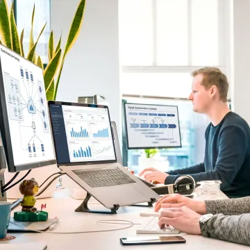 Technology consultants reviewing a digital strategy dashboard