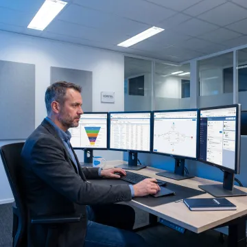 CRM advisory consultant reviewing customer dashboards