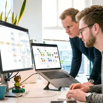 Digital transformation consultants reviewing business technology dashboards