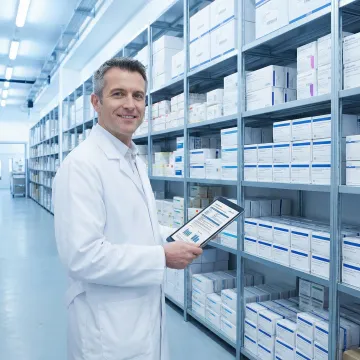 Pharmaceutical distribution specialist managing drug supply chain logistics in a licensed warehouse facility