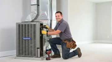HVAC technician performing system inspection during new home warranty service visit
