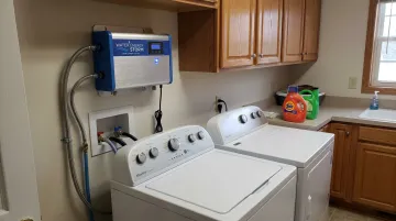 Water Energy Storm ozone laundry system installed showing dissolved ozone wash cycle