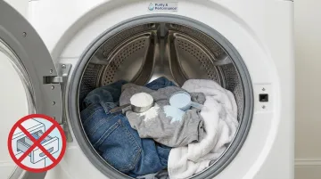 Laundry detergent and oxi powder placed directly on top of clothes in washer drum