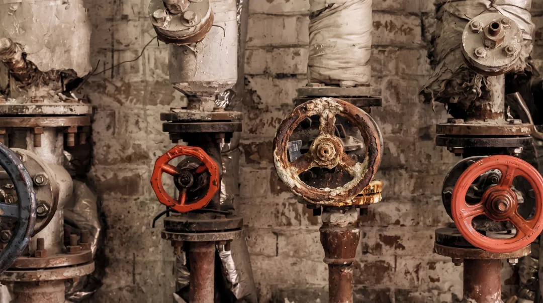 Worn commercial water valve damaged by turbulent flow and pressure