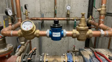 Water Flow Innovations FCD device installed at commercial water meter