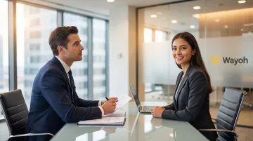 Bank hiring manager conducting structured competency interview with credit risk candidate