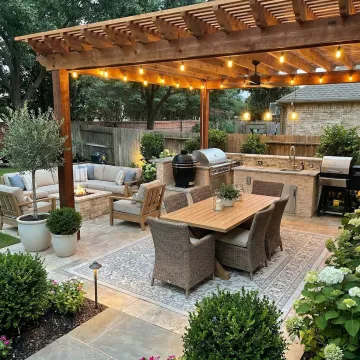 Custom designed outdoor living space with kitchen and seating in Georgia backyard