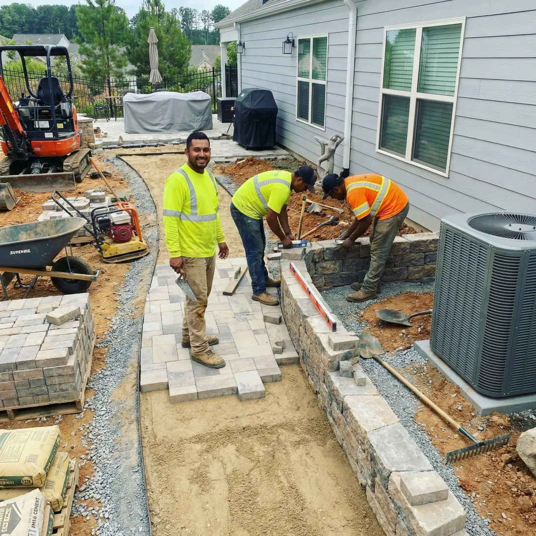 Landscape professionals installing garden renovation features
