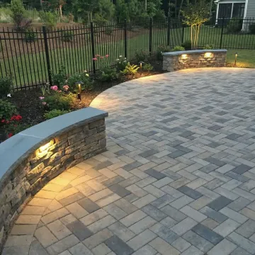 Professional hardscape patio installation with premium pavers and outdoor seating