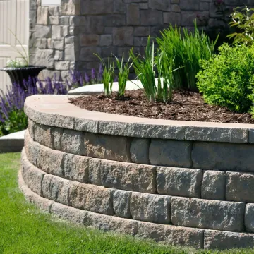 Custom designed garden wall with premium stone materials and landscaping