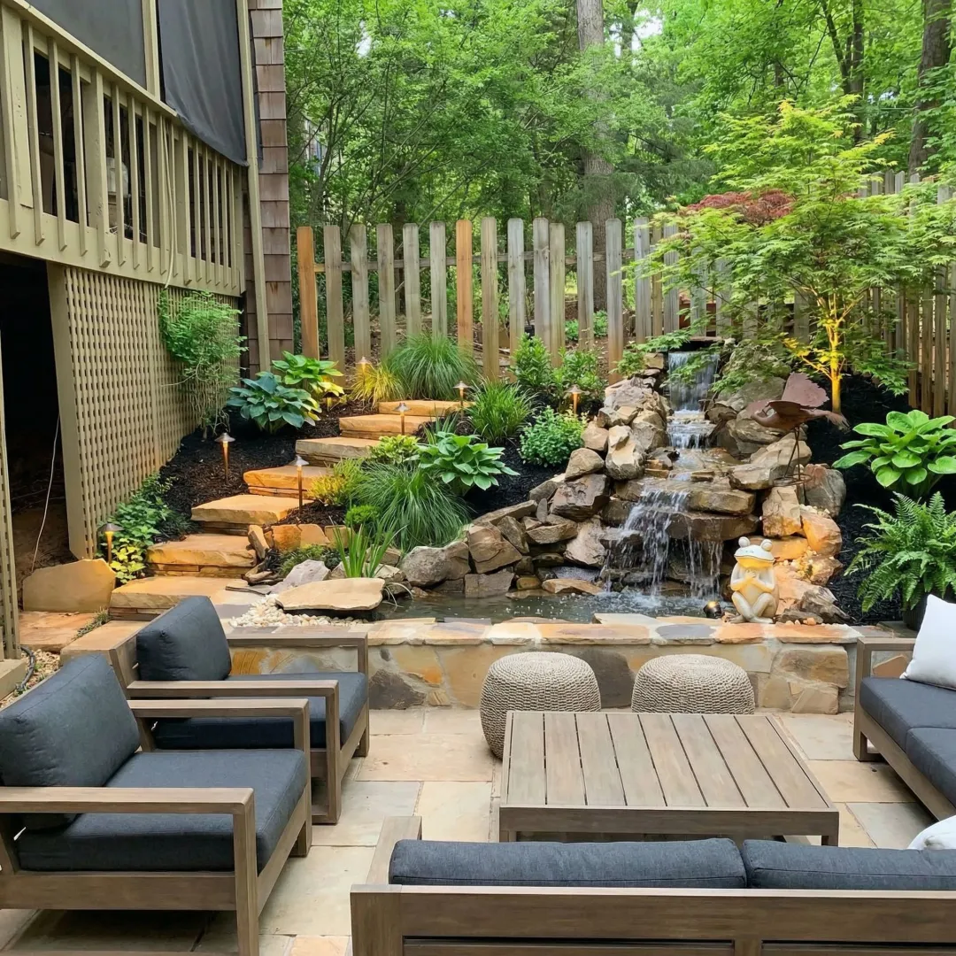 Beautiful custom landscape design with patio, plants, and outdoor living space