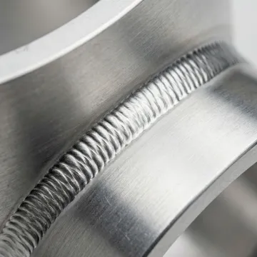 Close-up of precision aluminum TIG weld showing clean bead and minimal heat affected zone
