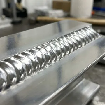 Close-up of clean aluminum weld bead showing professional welding quality