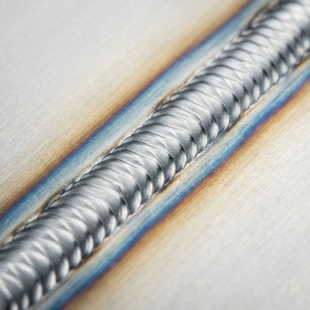 Close-up of high-quality carbon steel weld joint showing professional finish