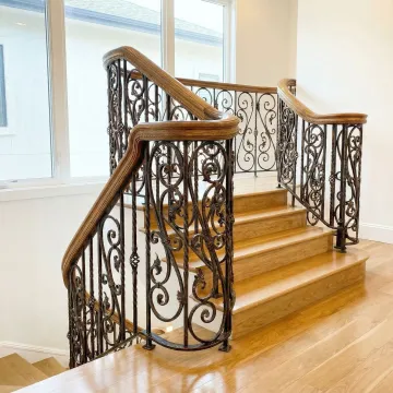 Elegant wrought iron staircase with custom railings in modern home interior