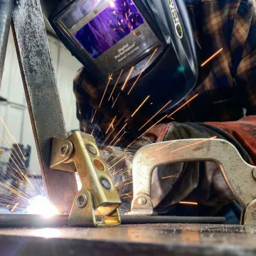Custom carbon steel fabrication showing precision welding and metalwork