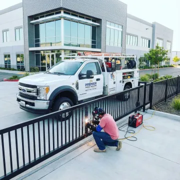 Mobile welding truck providing on-site commercial fence repair