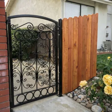Elegant custom wrought iron fence with wood integration