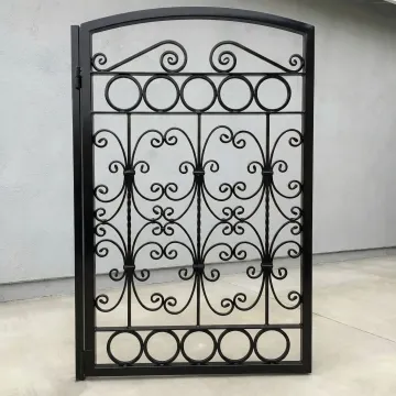 Custom wrought iron gate with intricate artistic metalwork design