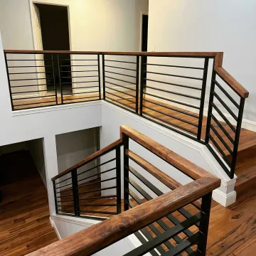 Beautiful wooden staircase railing with professional installation
